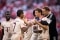 The image shows players of FC Bayern Munich on the football field