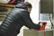 The image shows Georg Hackl making adjustments to the heater.