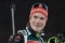 The image shows Benedikt Doll laughing.