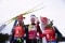 The image shows Benedikt Doll and two other athletes.
