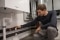 The picture shows biathlete Arnd Peiffer checking his Viessmann heating system