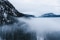 The image shows a mountain with fog.