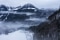 The image shows a mountain in the fog with the Jennerbahn.