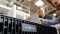 The image shows two Viessmann employees working on a heatpump in production