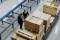 The picture shows two employees in a warehouse.
