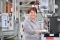 The image shows Olga Bossauer-Kalteis in production.