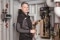 The image shows field service technician Patrick Schardt at a heating system.