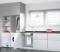 The picture shows Viessmann electric hot water systems under the kitchen sink. 