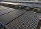 The image shows solar thermal collectors on a rooftop