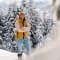 The picture shows the former top biathlete Laura Dahlmeier in front of a wintry backdrop.