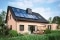 The image shows a single-family house with PV modules on the roof