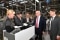 The image shows Boris Rhein (2nd from left) at the air-conditioning solutions provider Viessmann's production facility in Allendorf.