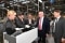 The image shows Boris Rhein (2nd from left) at the air-conditioning solutions provider Viessmann's production facility in Allendorf.