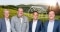 The image shows employees of Viessmann Climate Solutions and badenova in front of a green mountain landscape as a symbol of the cooperation.