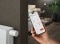 The image shows the ViCare app on the screen of a smartphone in a person's hand