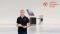 The image shows a Viessmann System Partner holding a tablet in front of a Viessmann system