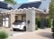 The image shows an electric car at a Viessmann charging station under a carport next to a house and a Viessmann heat pump, serving as a symbolic representation of the partnership between Viessmann Climate Solutions and LichtBlick.