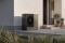 The image shows an outdoor unit of the Viessmann Vitocal 200-A ie in front of a house facade