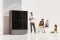 The image shows a heat pump and a family