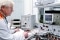 The picture shows an employee in the electrotechnical laboratory.
